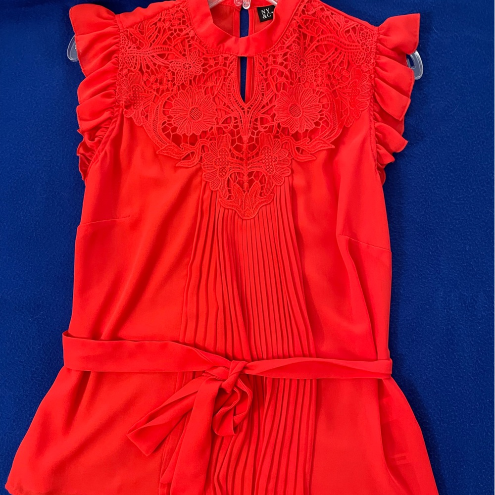 A red pleated blouse